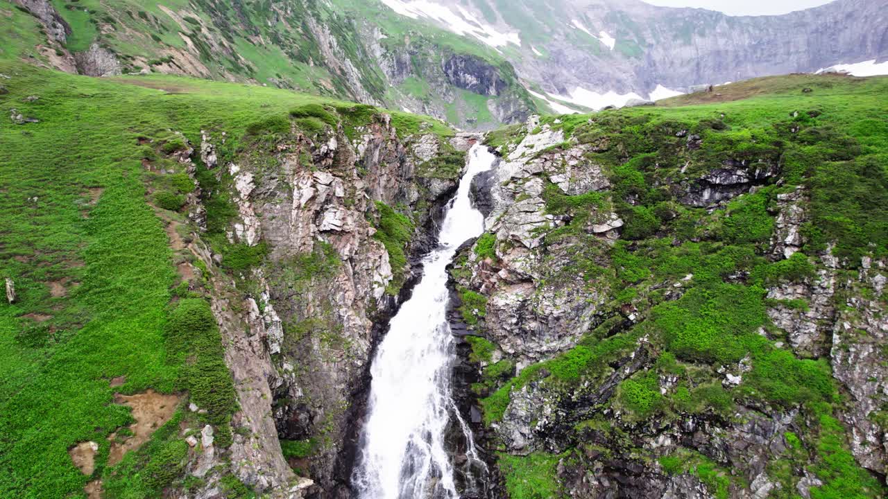 Aerial View of a Stunning Waterfall cascading down a Mountainside