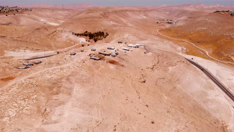aerial view of a desert informal settlement with makeshift housing and roads