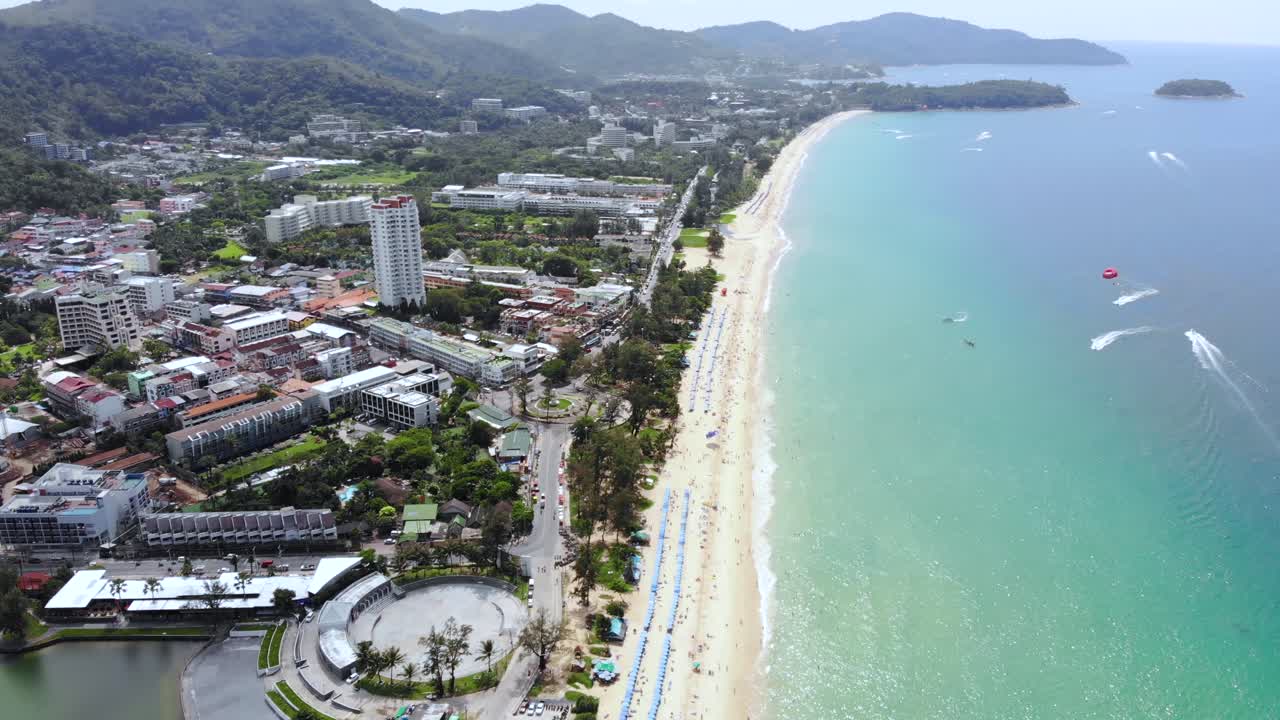 Panorama view of long beach strip of Patong, Phuket. Aerial tilt up