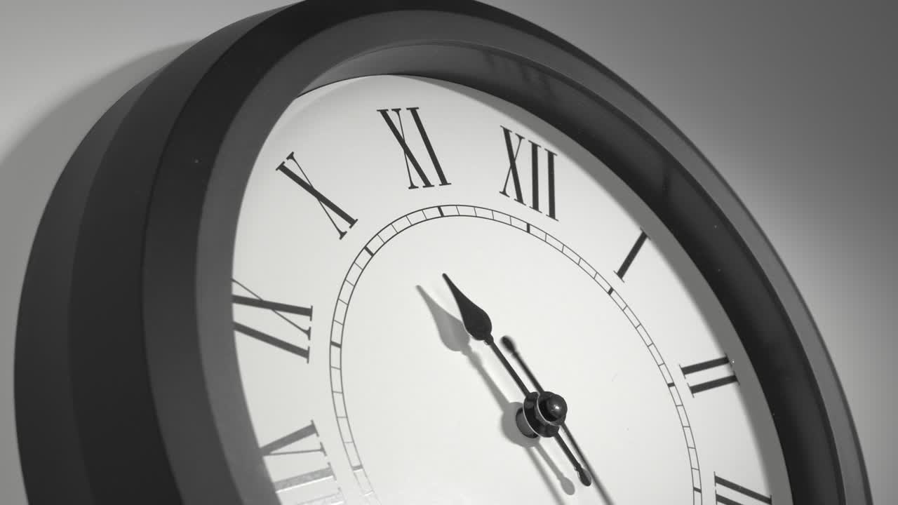 Latin Clock Face in Time Lapse on White Wall
