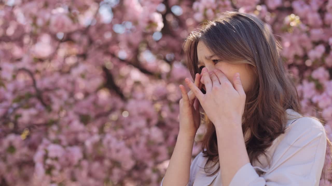 Woman experiencing spring allergy symptoms