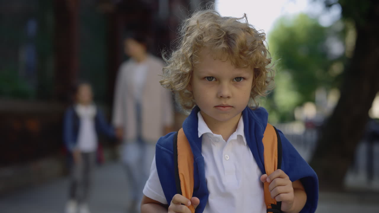 Child with Backpack on the Street