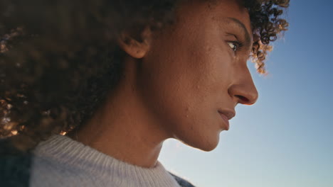 upset woman thinking sky background closeup. girl with boyfriend after breakup
