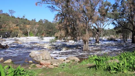 Bells-Rapids-Perth-In-Winter---Pan-Right-Shot-,People-Crossing-Bridge