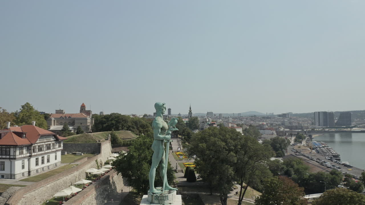 Belgrade, Serbia cityscape reveal with The Victor monument in the foreground.