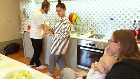friends and family gathering in a kitchen