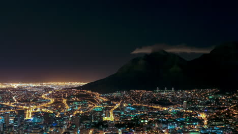 a night view of the city of cape town, south africa. static time lapse, long exposure, moving traffic. captured from signal hill.