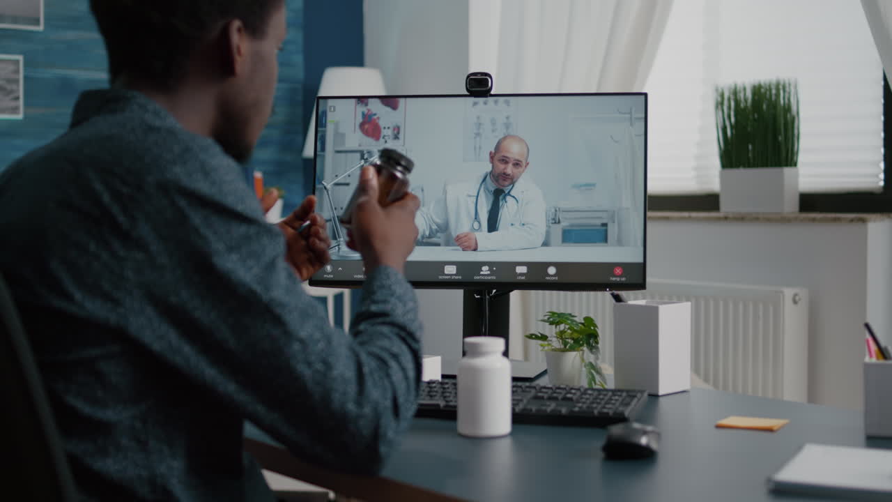 Online internet health checkup of black man talking with family doctor