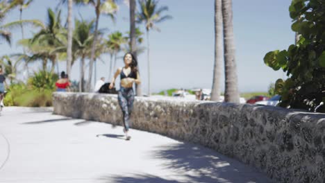 Running-happy-girl-training-on-shore