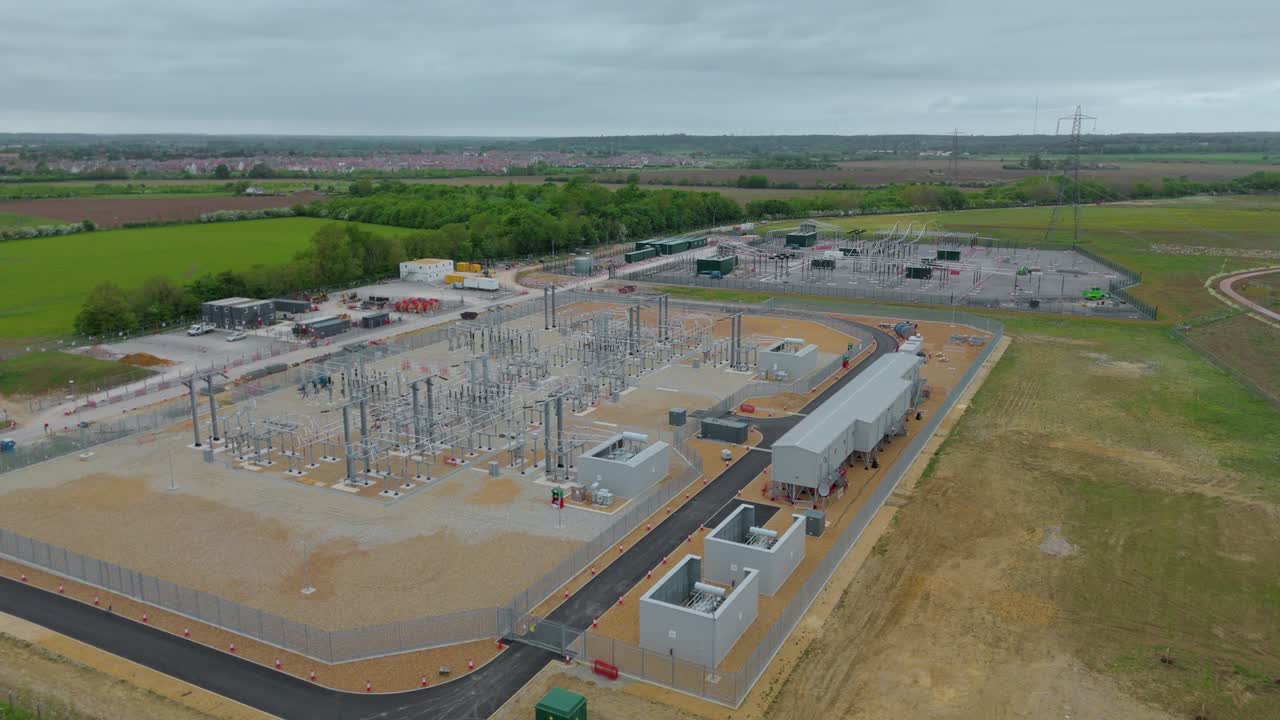 Aerial drone view of Biggleswade electric sub station England UK power pylons and terminals energy generation