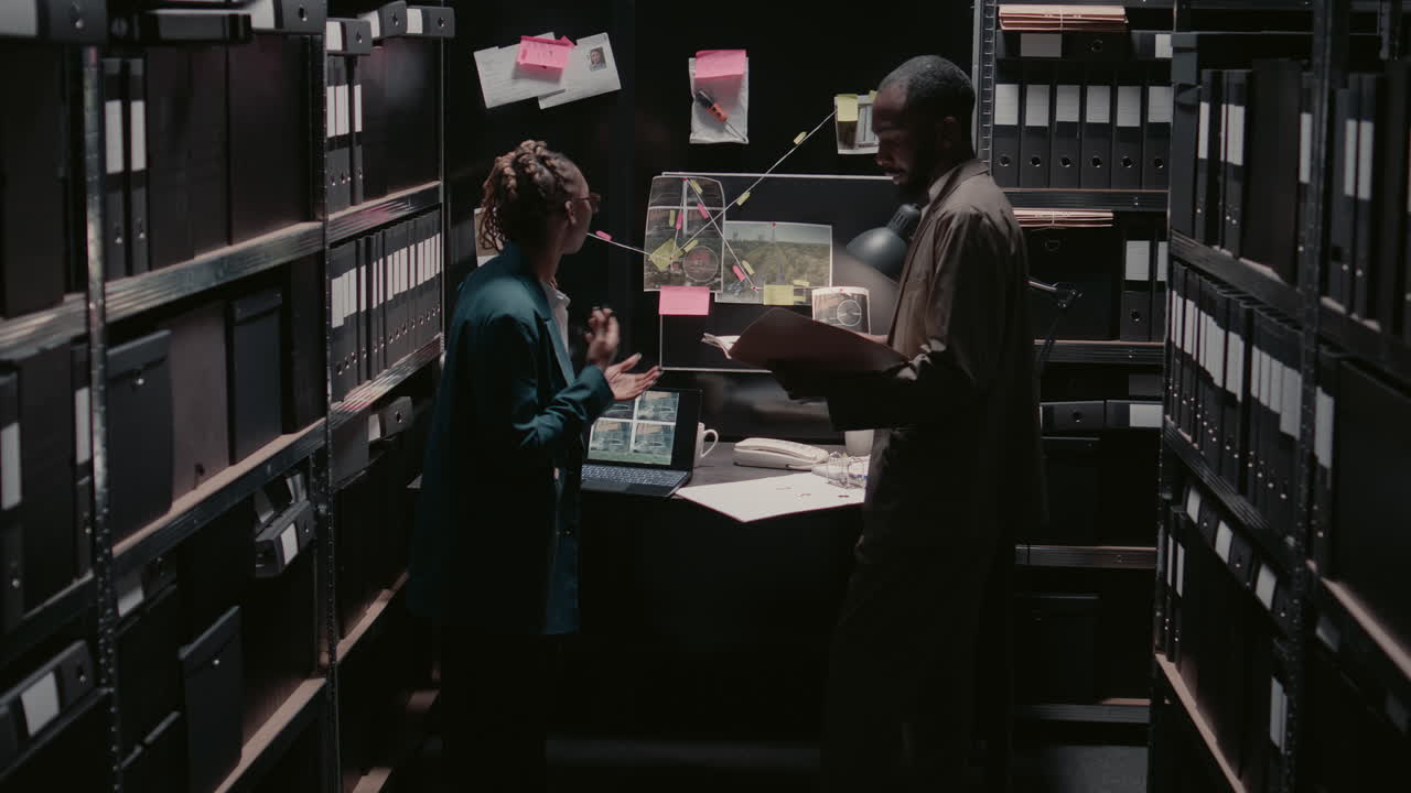 Detectives Investigating a Case in Their Office