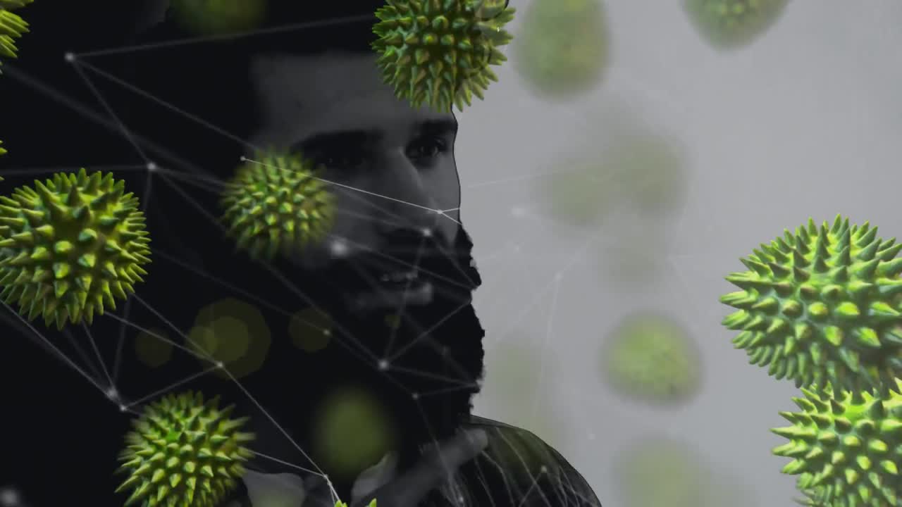 animación de un hombre de raza mixta frotando su barba sobre células de covid-19 flotando.