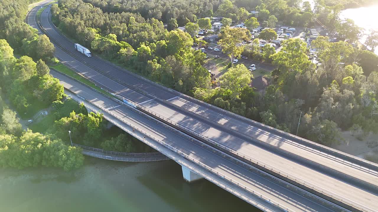 Vehicles crossing bridge in scenic Brunswick Heads