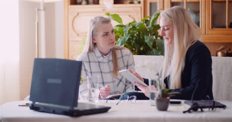 Female-Colleagues-Discussing-Business-Strategy-2