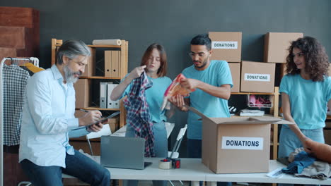 volunteers sorting and packing donations