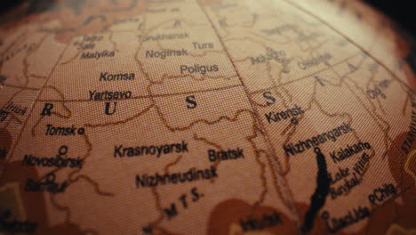 close-up of a vintage globe map, focusing on siberia, russia