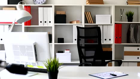 light office interior with black office-chair