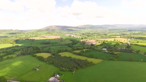 aerial-view-of-agricultural-farmland-looking-out-towards-hills-in-the-distance