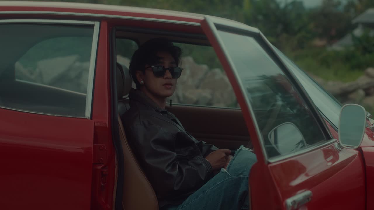 Man in vintage car