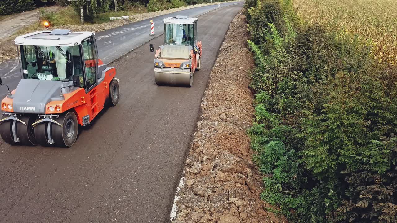 Large road-roller paving a road. Road construction