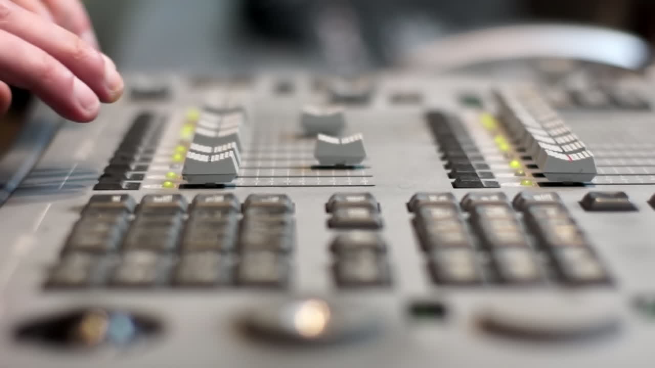 Hands on a Professional Audio Mixing Console