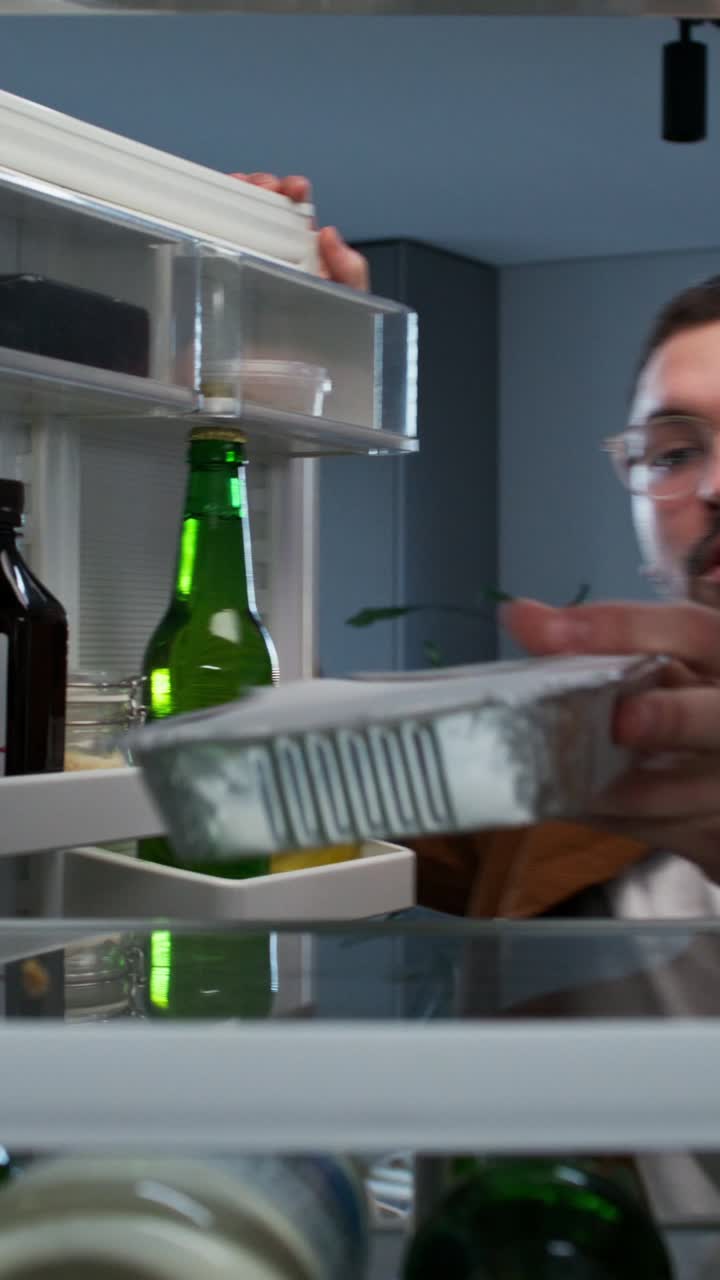 Person looking inside a refrigerator