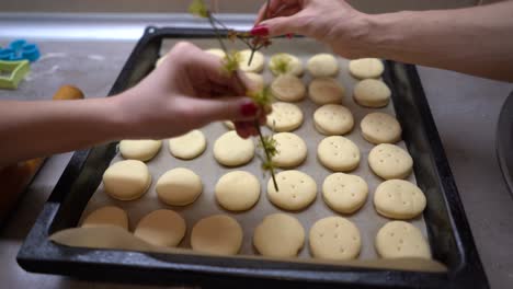 mother and daughter making cookies at home