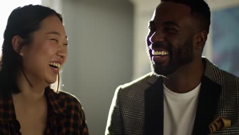joyful moment of laughter: two friends share a heartwarming experience in a brightly lit room, capturing the essence of connection and happiness