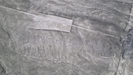 aerial view above the nazca lines and humanoid creatures in nazca, peru