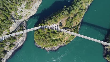 ascending top down birds eye view drone shot of deception pass bridges in anacortes washington wa usa on a sunny spring day