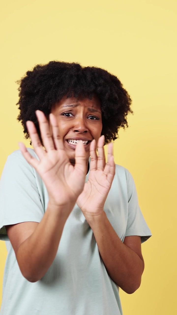 Young African American Woman Showing Fear and Rejection