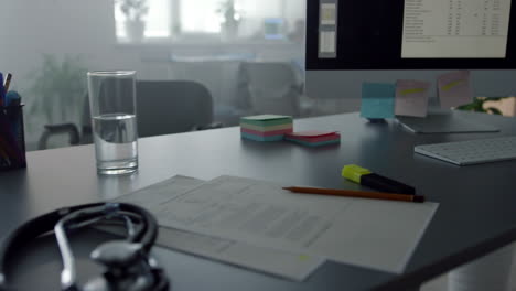 View-doctor-computer-screen-on-work-desk-close-up.-Modern-physician-workplace.