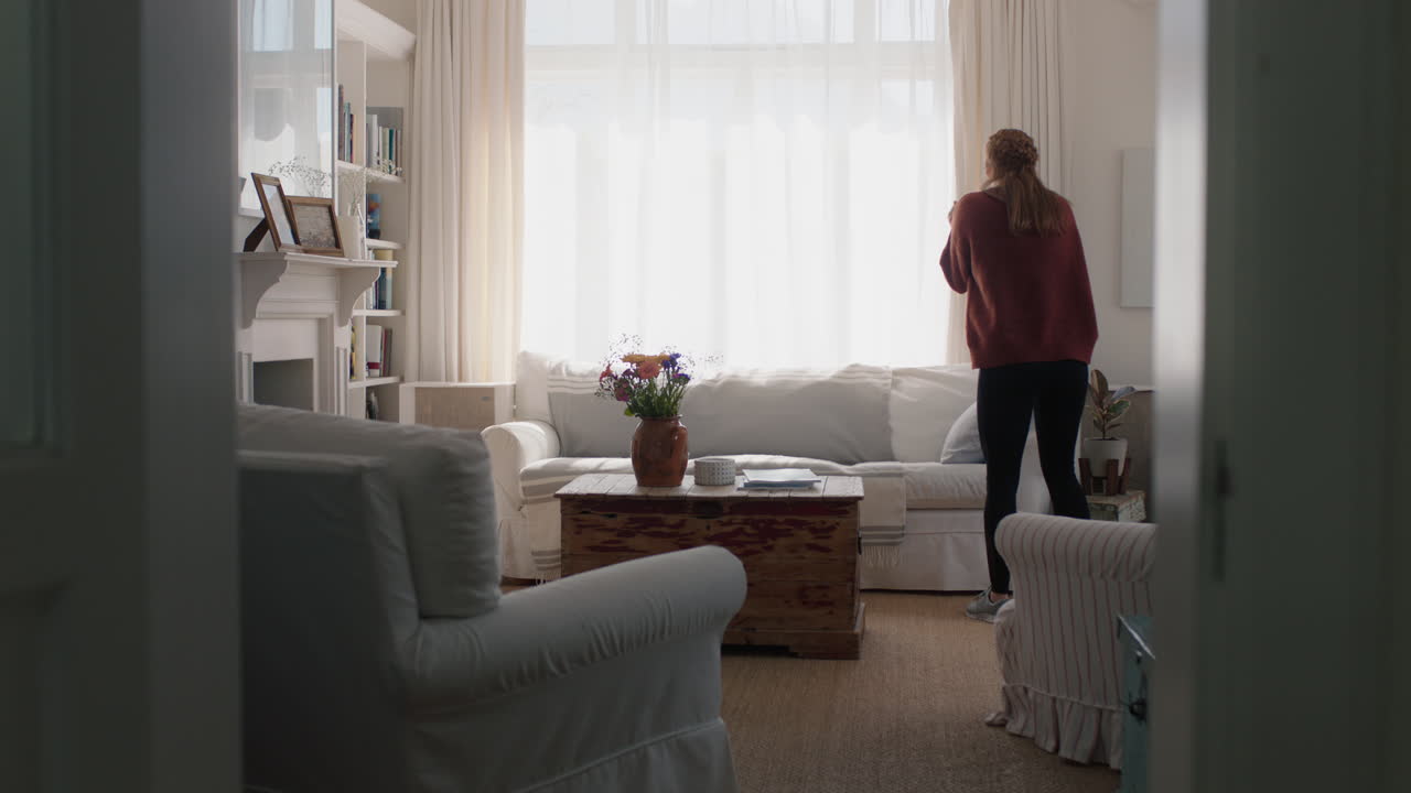 happy young woman dancing at home having fun celebrating with funny dance moves enjoying freedom on weekend 4k footage