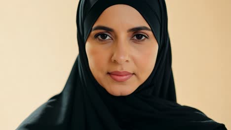 a close-up portrait of a young woman wearing a hijab.