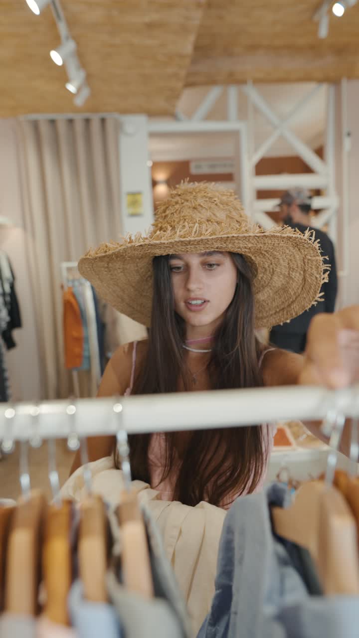 A woman browsing clothing at a retail store