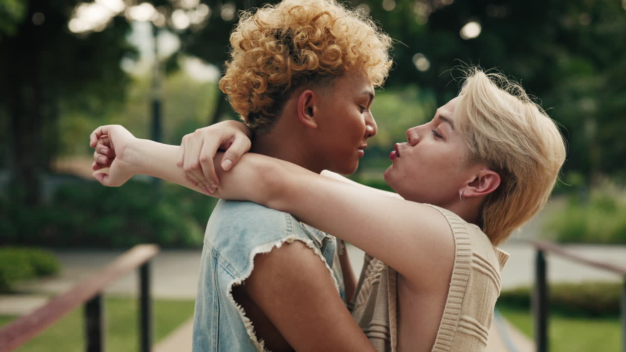 Two Young Men Sharing a Tender Embrace in the Park
