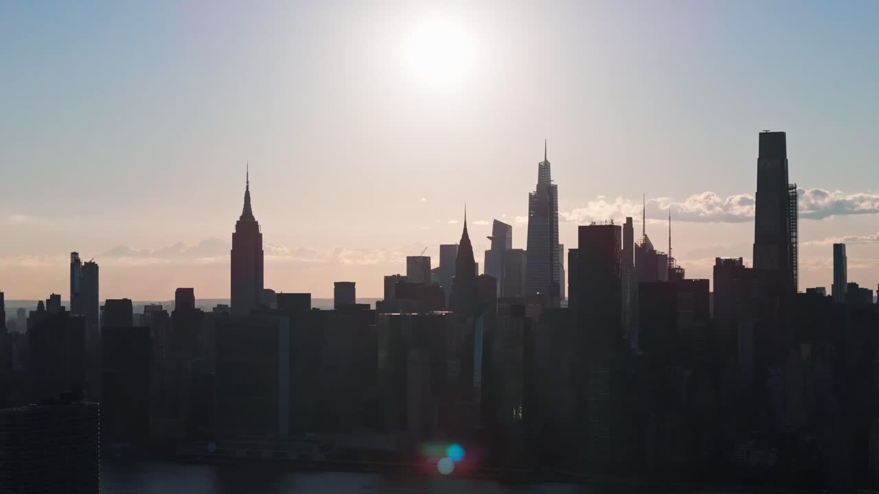 Drone shot of sun shining above Midtown Manhattan