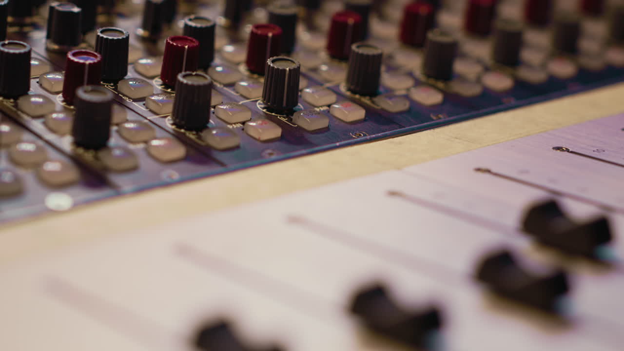 Pre amp knobs and switchers on mixing console panel board