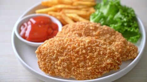 fried chicken breast fillet steak with french fries and ketchup