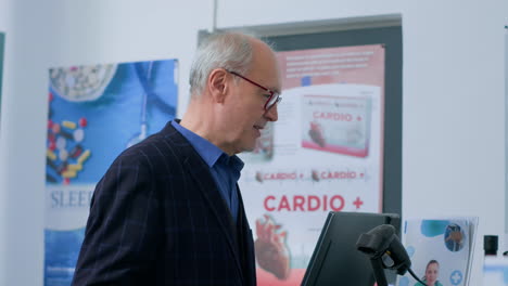 elderly man at drugstore checkout