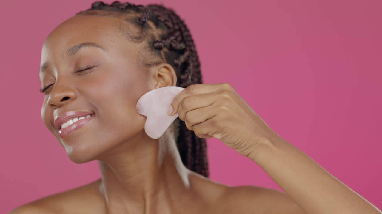 Black woman, face or gua sha in skincare beauty