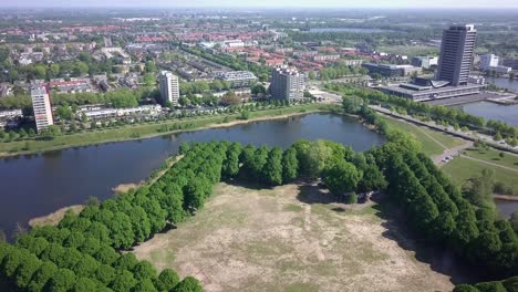 aerial footage of flying over the star shape city park in europe-holland and facing to the city in 4k