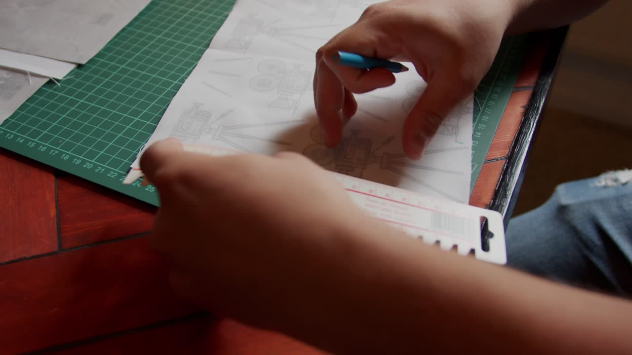 Marking on fabric with a blue marker. Rotating side high view.