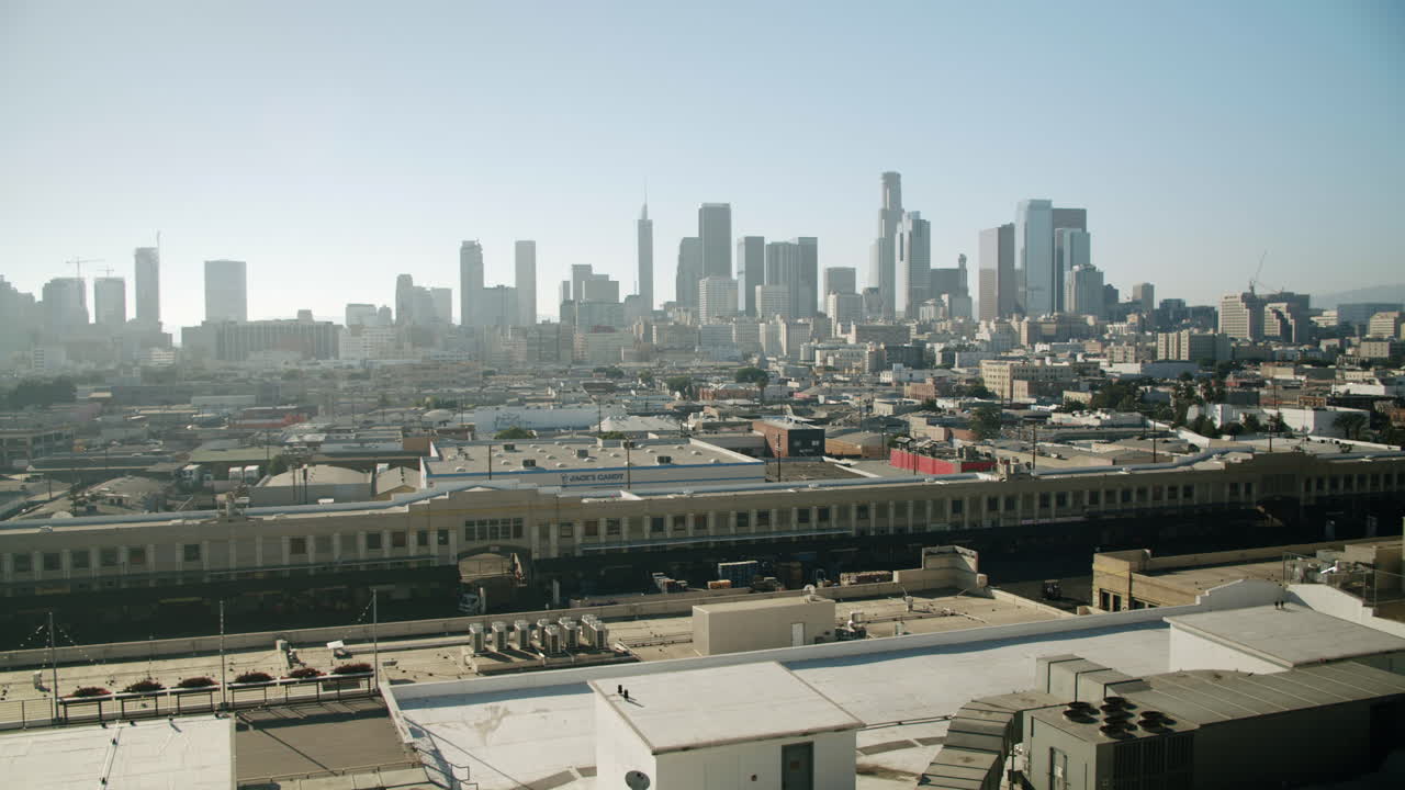 Daytime panoramic view of the Los Angeles downtown cityscape with skyscrapers and industrial buildings