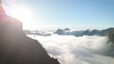 independent-girl-watches-over-mountain-landscape,-standing-on-mountain-ridge,-feminism-concept