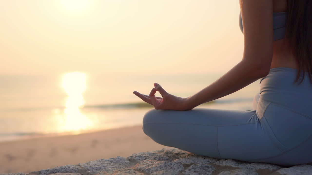 Woman Practicing Yoga at Beach Sunset