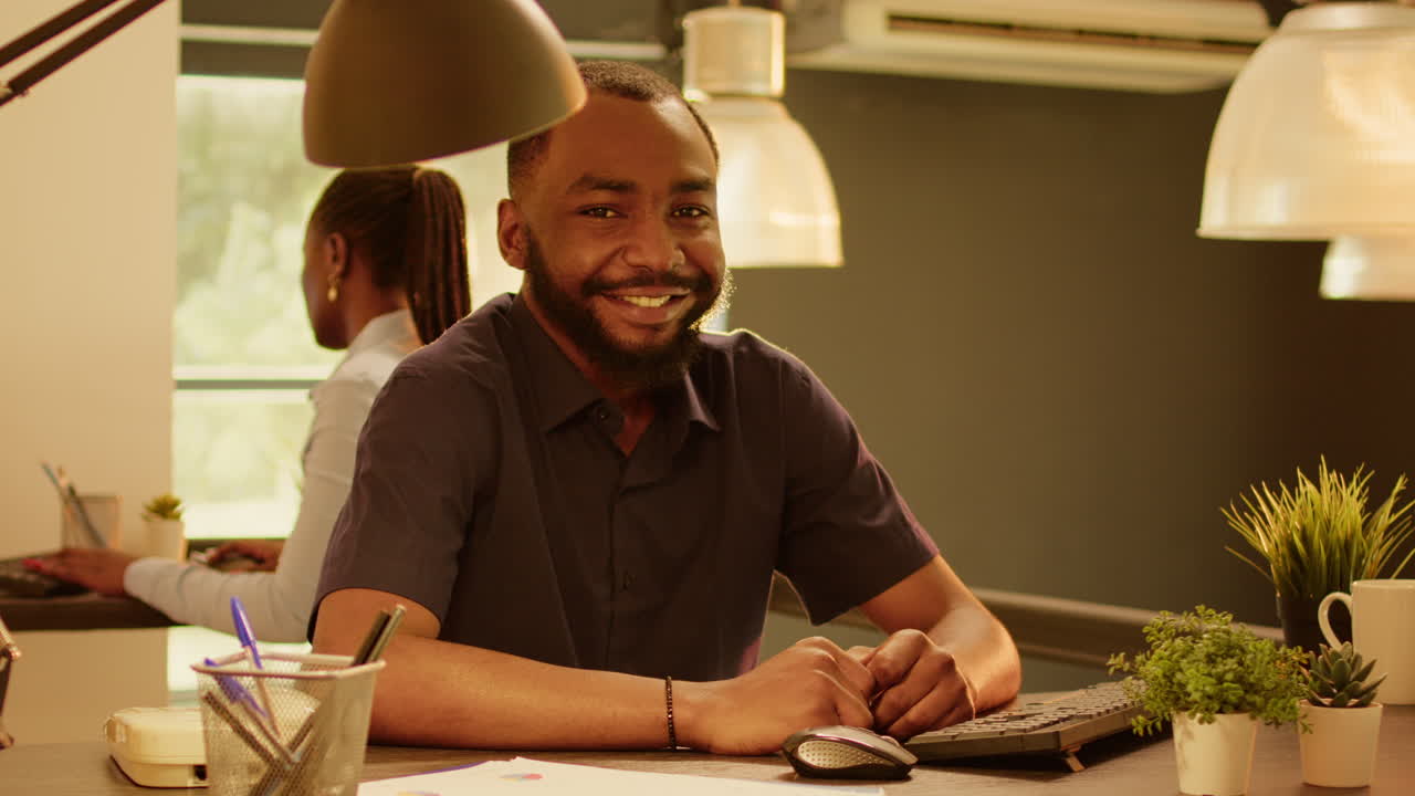 Man Working at His Desk in an Office