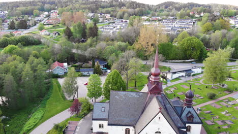 4k aerial footage overhead looking down at church in lerum, town in vastra gotaland, sweden