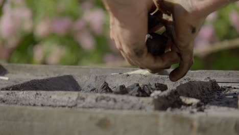 Close-Up-Shot-Of-Professional-Blacksmith-Preparing-Coal