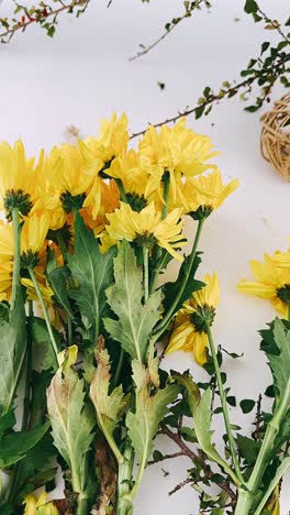 yellow and white flowers arrangement